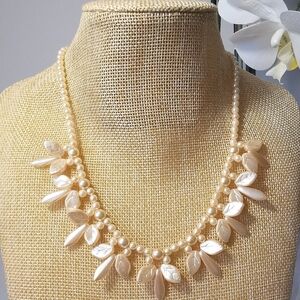 Vintage cream pearl necklace in leaves